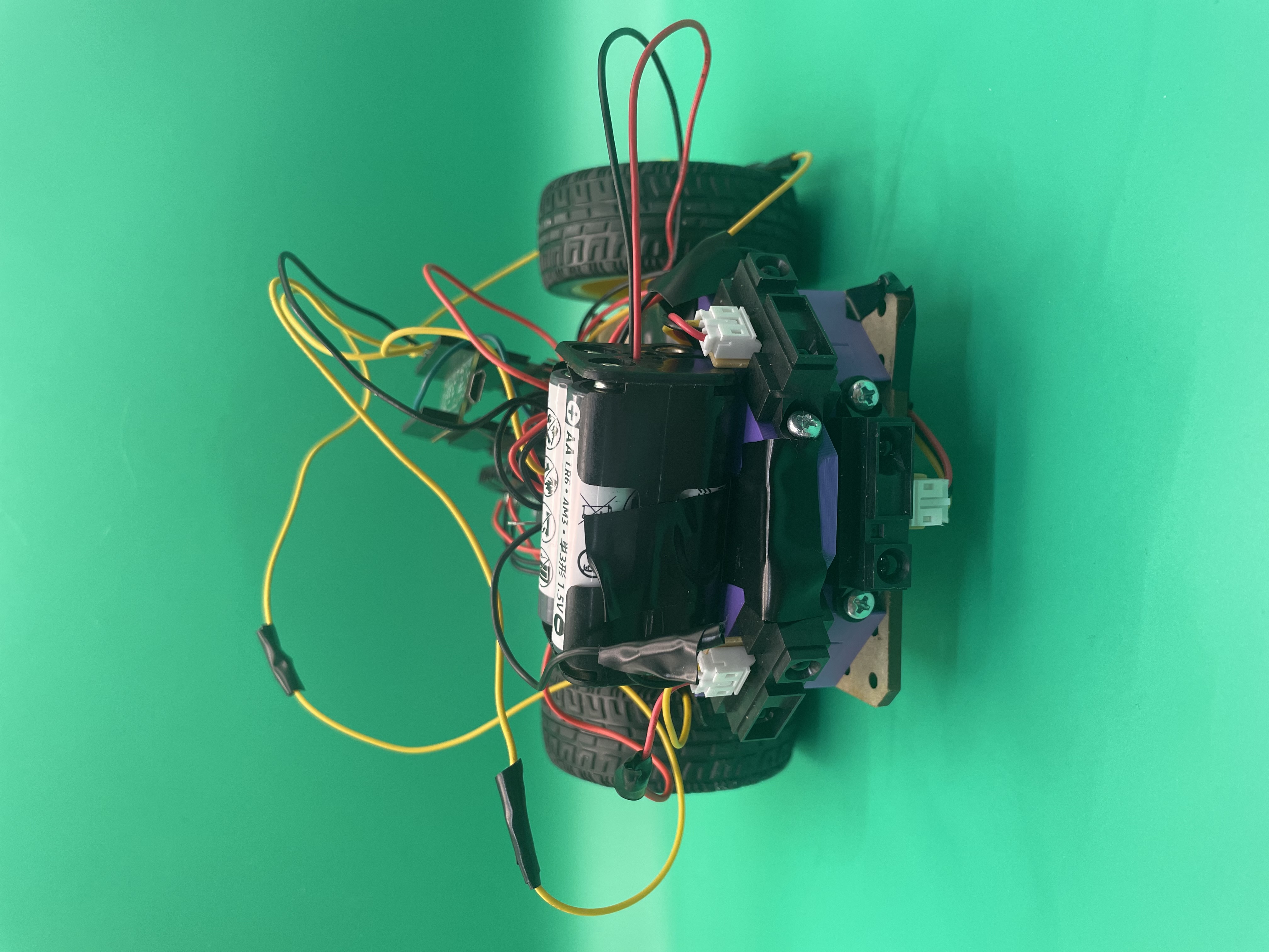 Autonomous robot in initial build stage showing wiring and battery pack