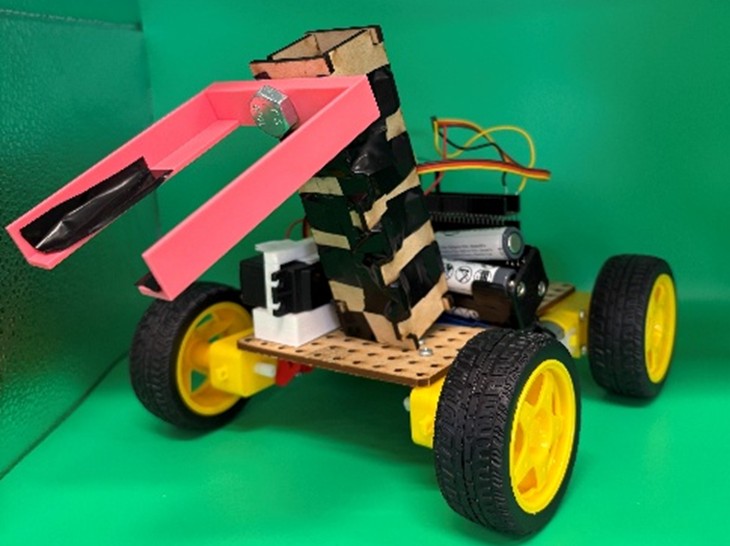 Failed claw rescue bot prototype photo on green background