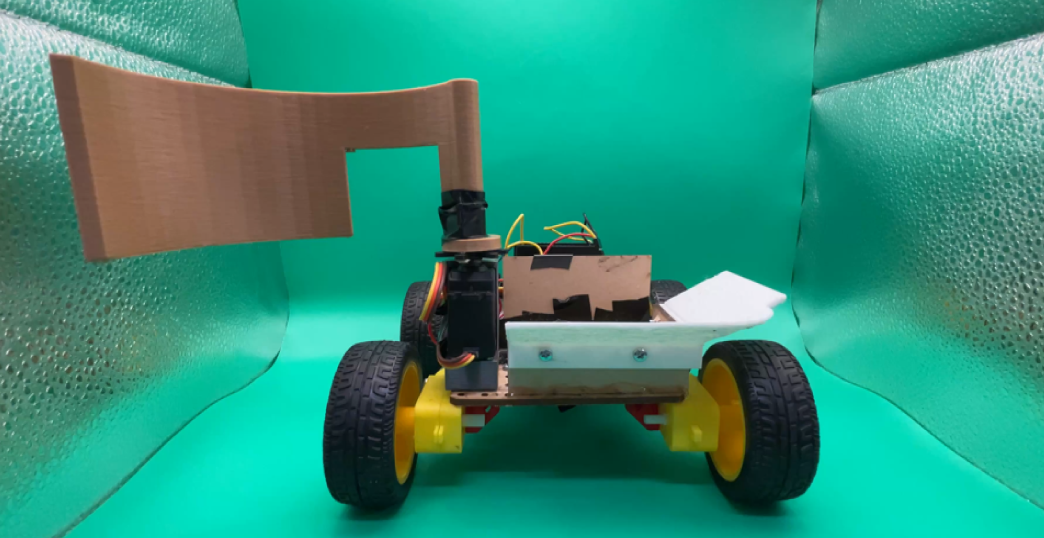 Final rescue robot with servo-driven sweep arm and onboard basket